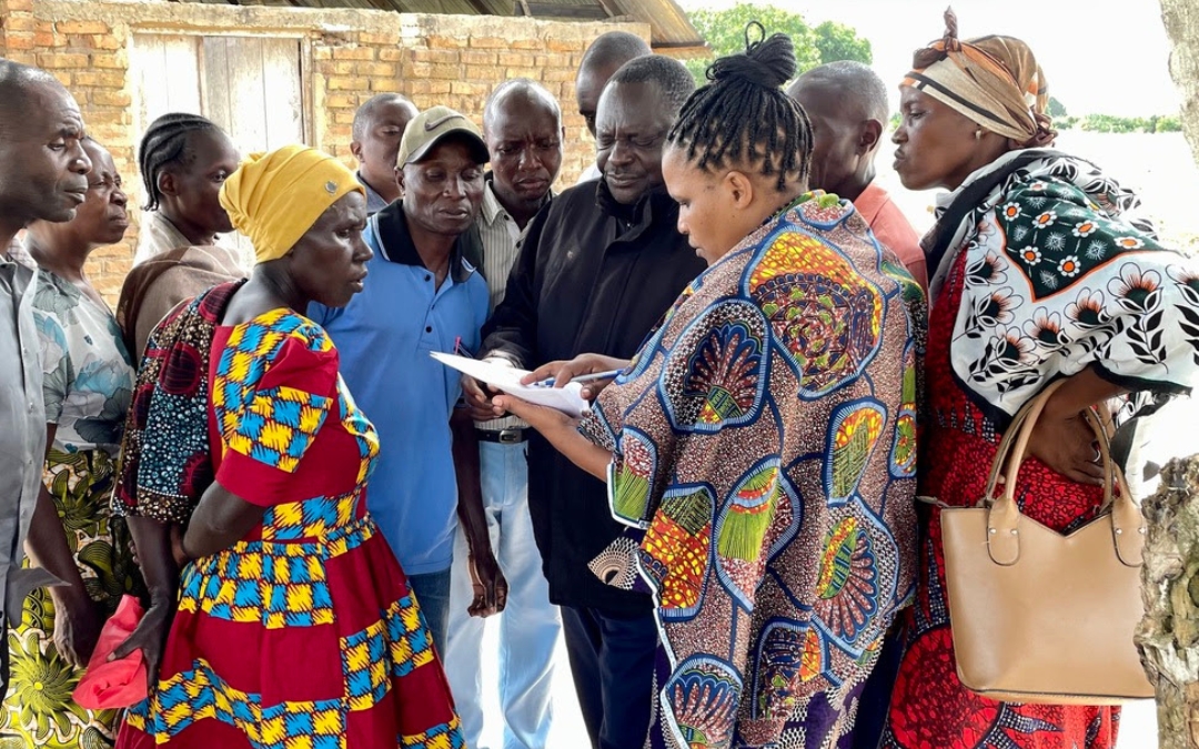 A group of African people meeting to plan evangelism efforts.