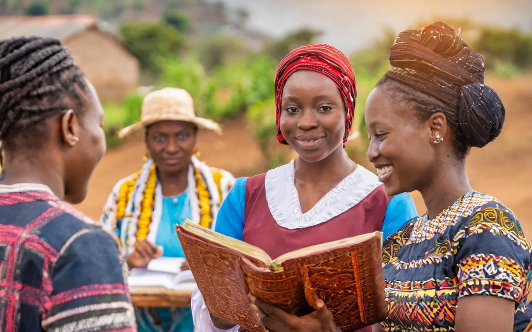 Kenyan woman sharing a Bible with others