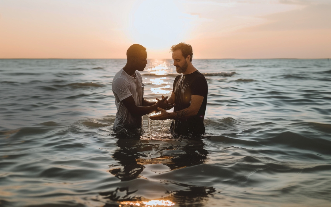 A man baptizing another young man in the ocean in Florida