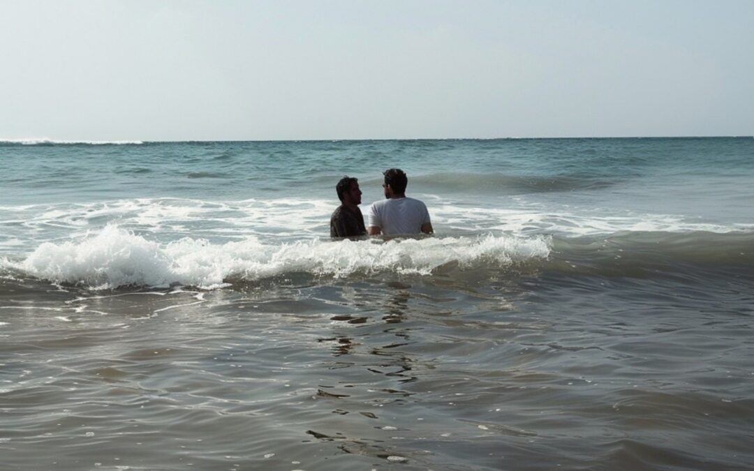 A man baptizing another man in the Middle East
